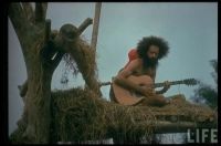 Playing the Guitar, Praying for the rain to stop